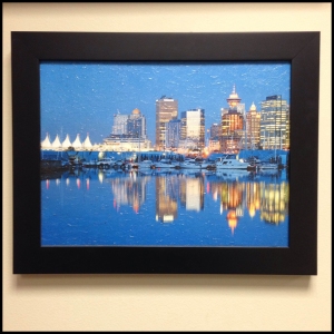 This plain black frame commits the viewer's attention to the textured canvas print while highlighting the rich blues of the image.
